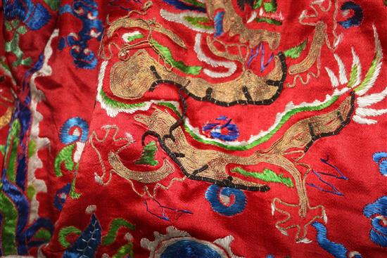 An early 20th century red satin dragon robe